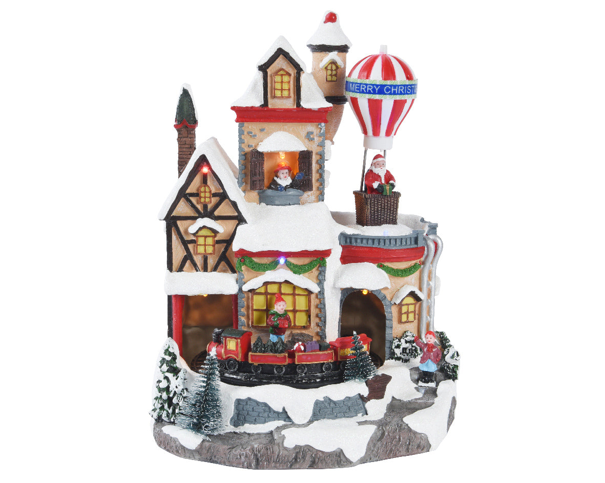 Villaggio di Natale con trenino e mongolfiera Lun.18.5cm Lar.21cm Alt.28cm Kaemingk Villaggio di Natale con trenino e mongolfiera Lun.18.5cm Lar.21cm Alt.28cm Kaemingk